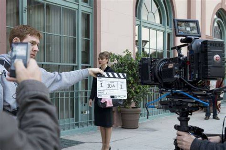 Behind the scenes shot of Janelle Monáe speaking with the director of 'Glass Onion: A Knives Out Mystery'