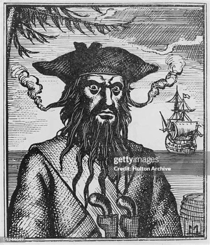 Circa 1715, Captain Edward Teach (1680 - 1718), better known as Blackbeard, a pirate who plundered the coasts of the West Indies, North Carolina and Virginia. His hair is woven with flaming fuses to increase his fearsome appearance. and One Piece's Blackbeard