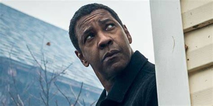 Denzel Washington is looking down.
