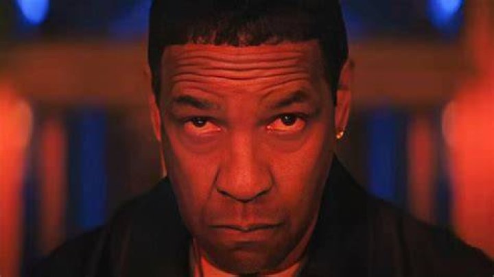 Denzel Washington is looking straight ahead.