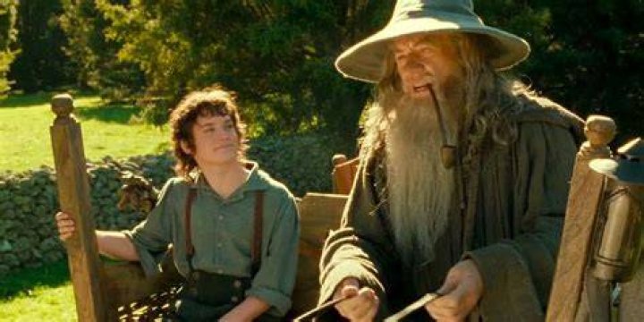 Gandalf is looking into the sky in Lord of the Rings.