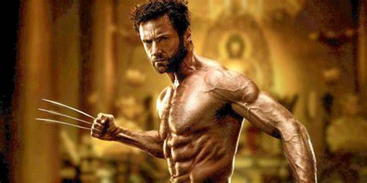 Hugh Jackman's Wolverine screams out in pain as Kitty Pryde uses her powers to send him back in time in 'X-Men: Days of Future Past'