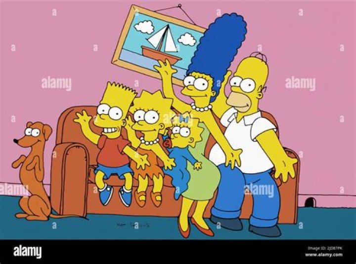 Marge and Homer are sitting at the kitchen table in The Simpsons.