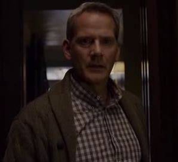 Richard Parker (Campbell Scott) works on his Sony laptop on a plane in The Amazing Spider-Man 2