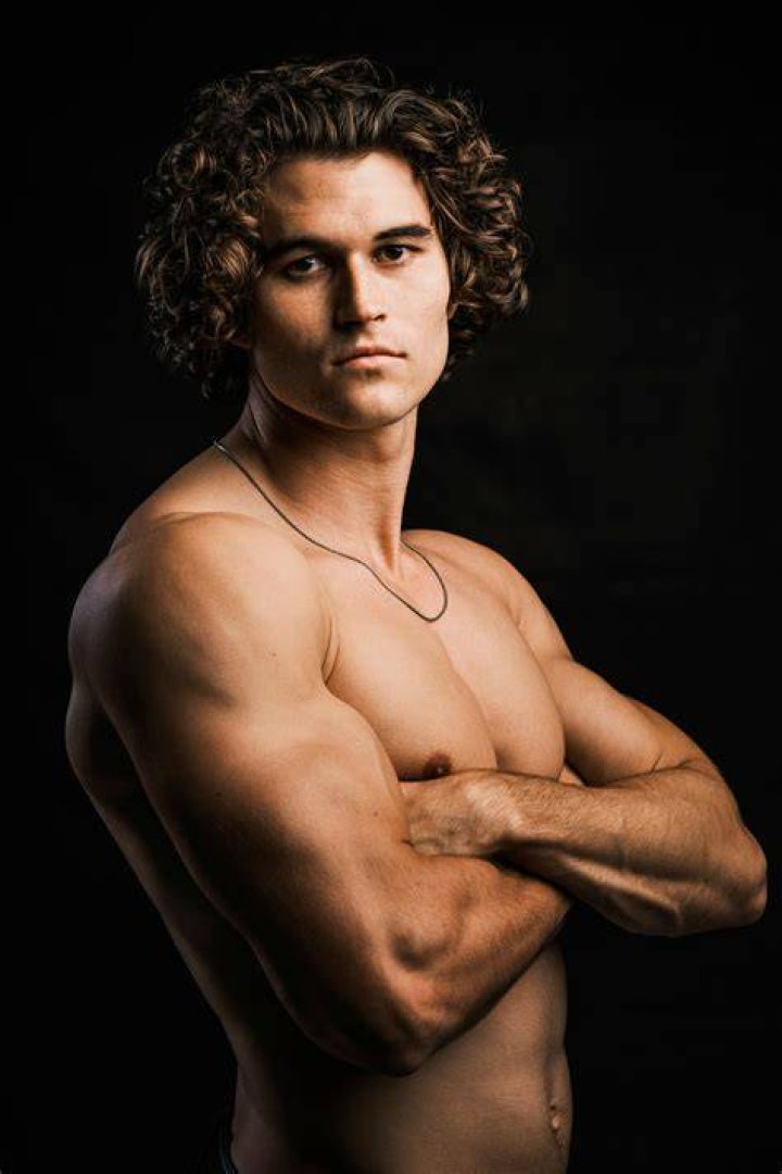 Travis Garret Long poses for his headshot