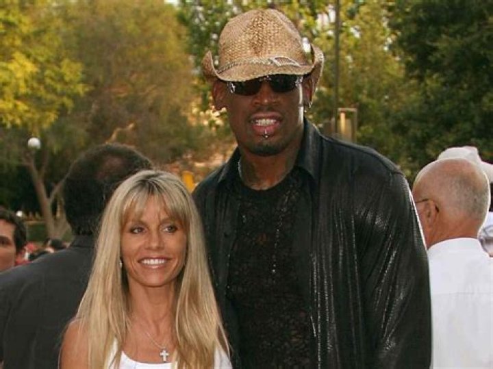 What does Dennis Rodman's mother do for a living?